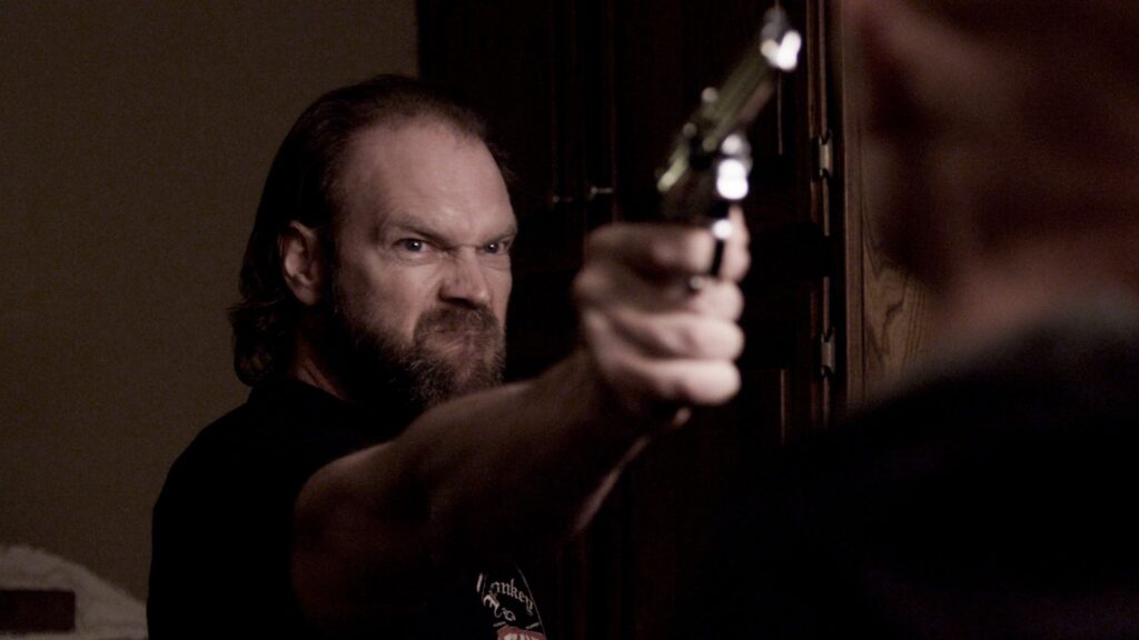 Michael (Tyler Mane) confronts William (Derek Mears) after prying the handgun away from his nephew in 'Compound Fracture'